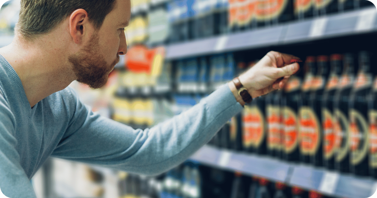 beer shelf stocked with domestic, imported, and craft beer