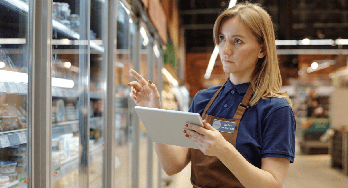 grocery store staff checking prices